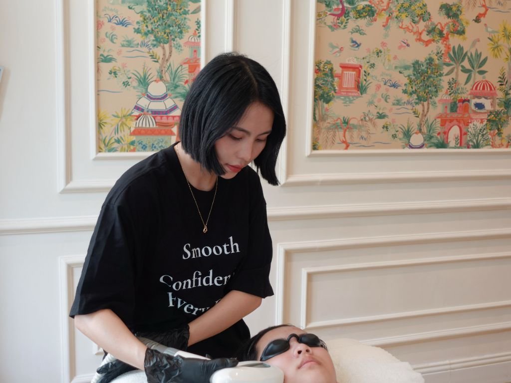 Facial treatment against the signature wallpaper at LINH LAN, Saigon